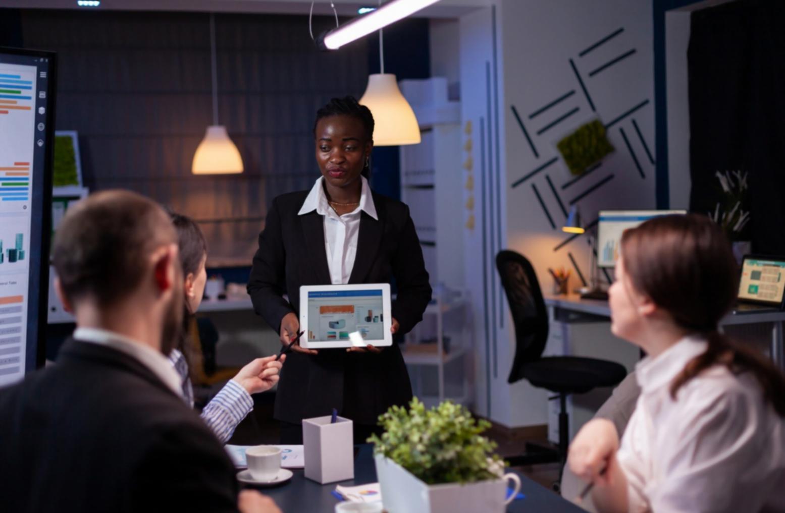 Business meeting discussing financial projections and analysis